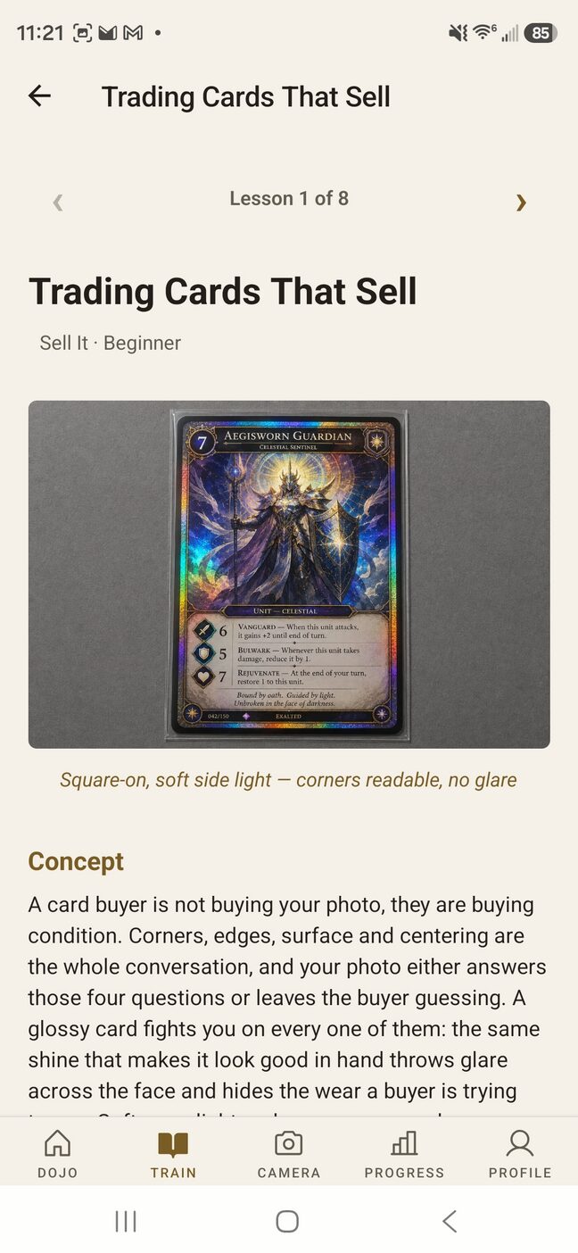 The Trading Cards That Sell lesson, first of the eight Sell It lessons. The lesson illustration shows a holographic card square-on under soft side light, captioned “corners readable, no glare.”